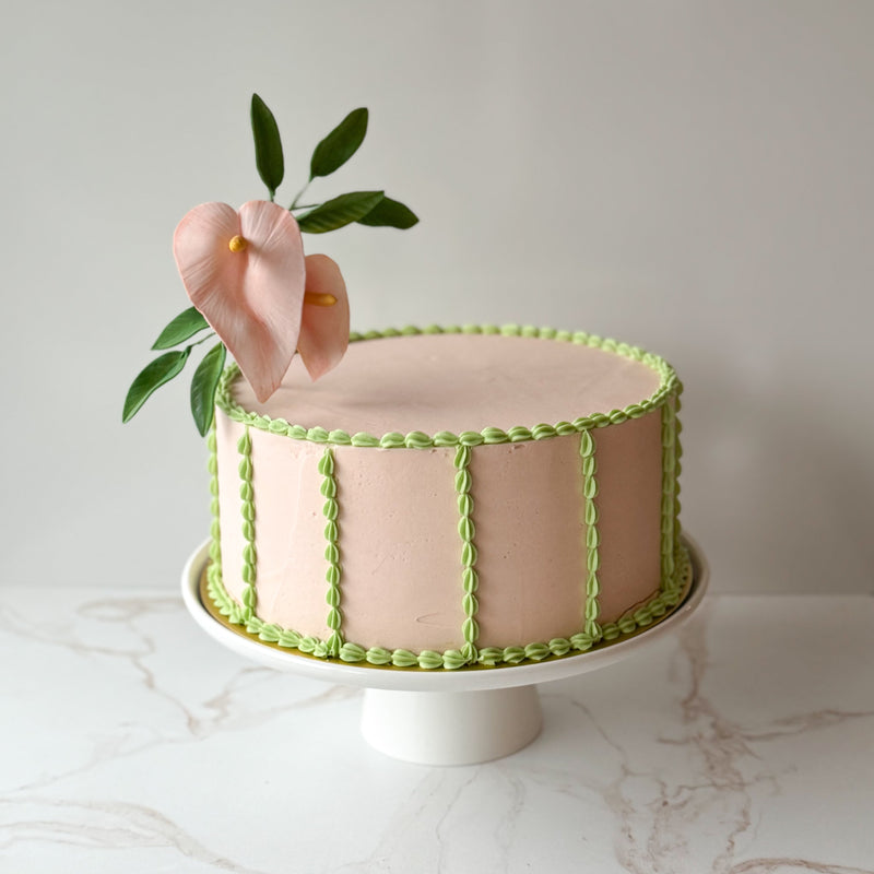 anthurium gum paste flower  pink flower and green decorations on a seattle wedding cake